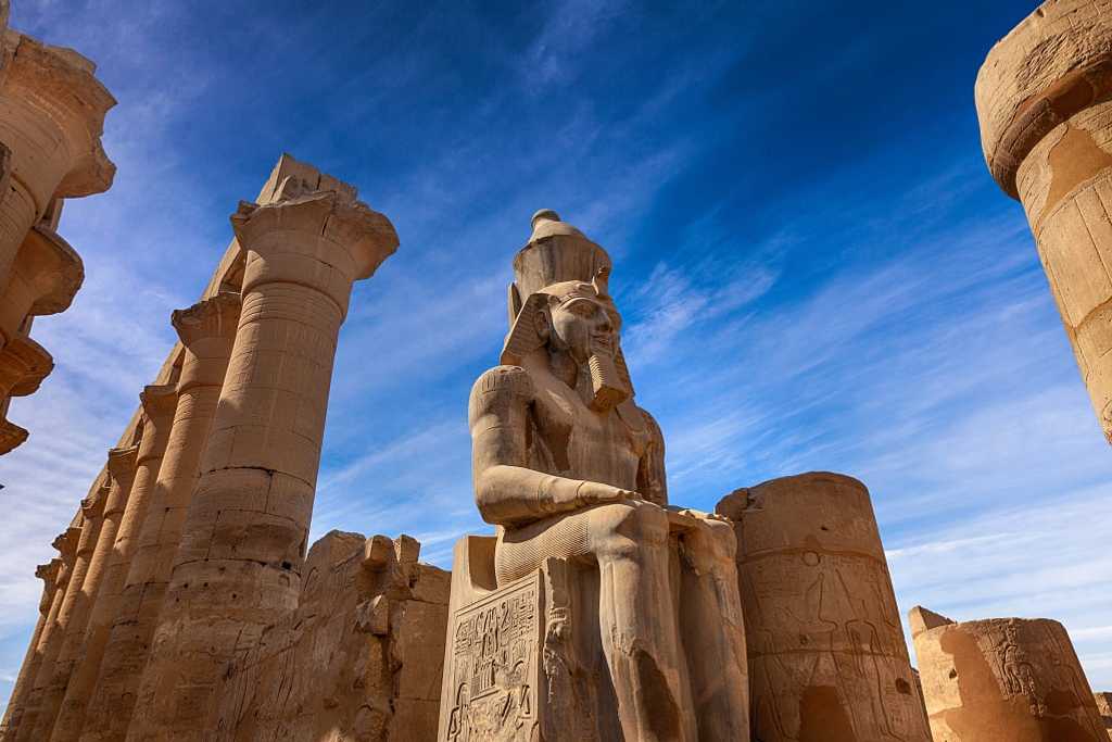 Stone statue of Ramses II at Karnak Temple in Luxor, Egypt