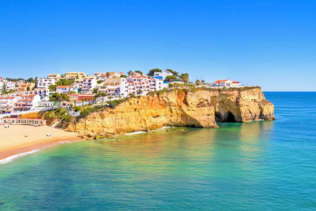 Beach and cliffside town of Carvoeiro, Portugal