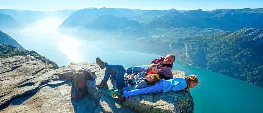 Family at Preikestolen, also known as Pulpit Rock, in Norway