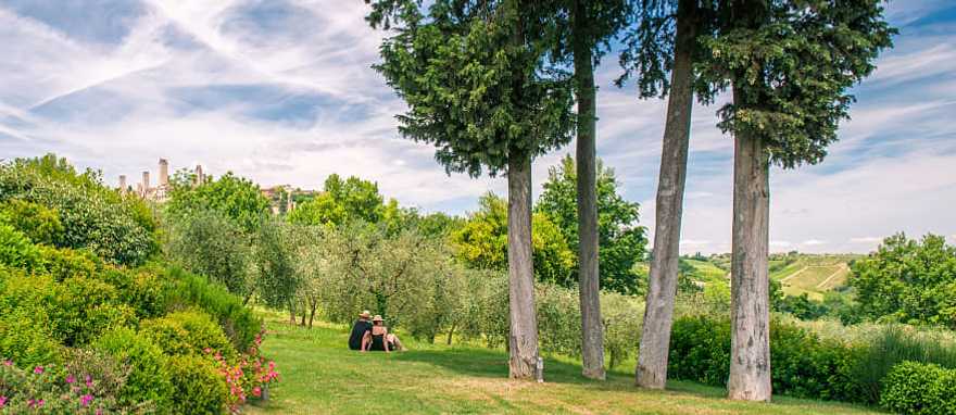 Tuscany, Italy Couple relaxing and enjoying the view of the Tuscany countryside in Italy