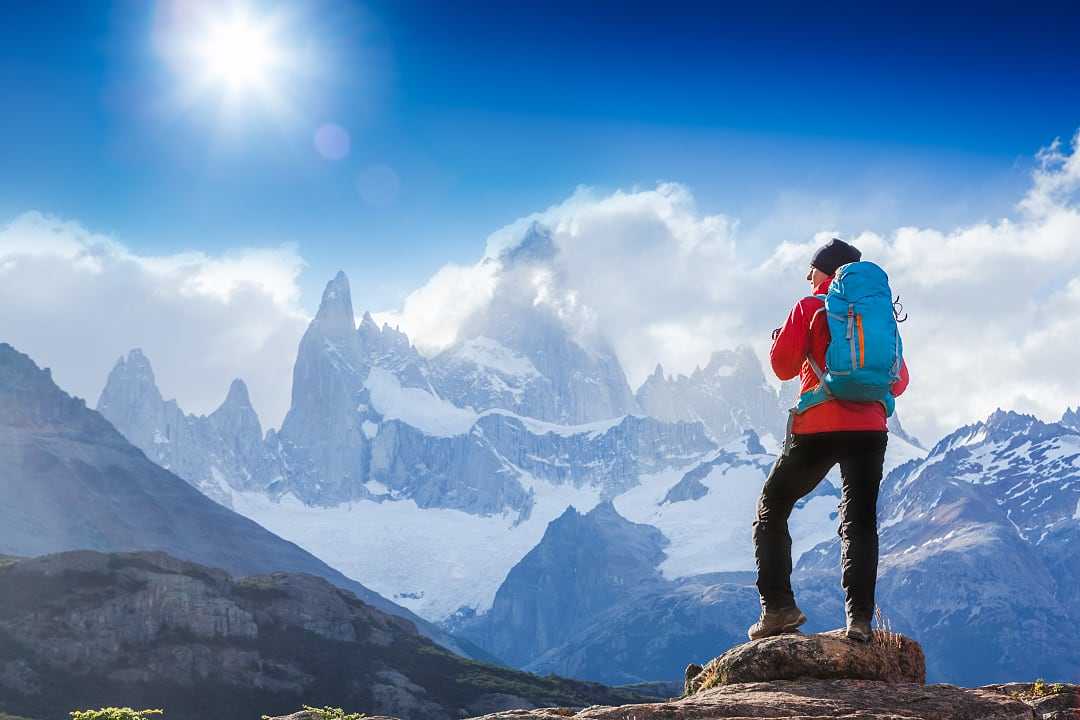Hiker stopping to admire Mount Fitz Roy in Patagonia
