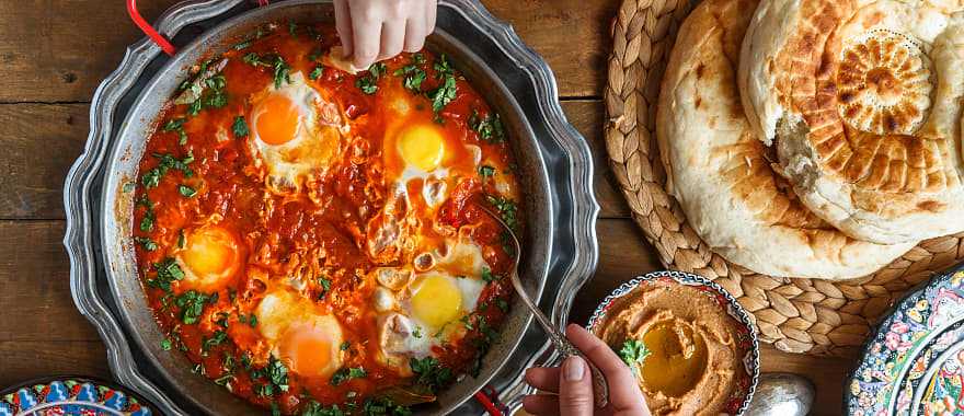 Traditional Shakshuka dish and bread served at a restaurant in Israel