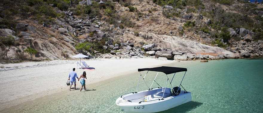 Couple on secluded beach on Lizard Island, Australia