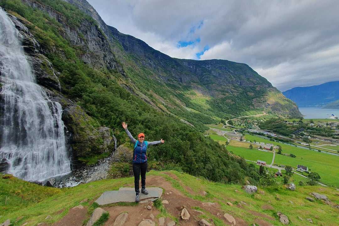Olena at a waterfall in Flåm, Norway