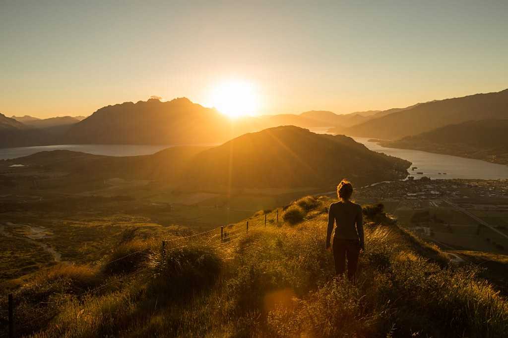 Watching the sun set behind the mountains in Queenstown, New Zealand