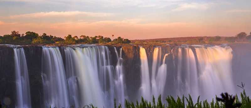 Victoria falls at sunset in Zimbabwe