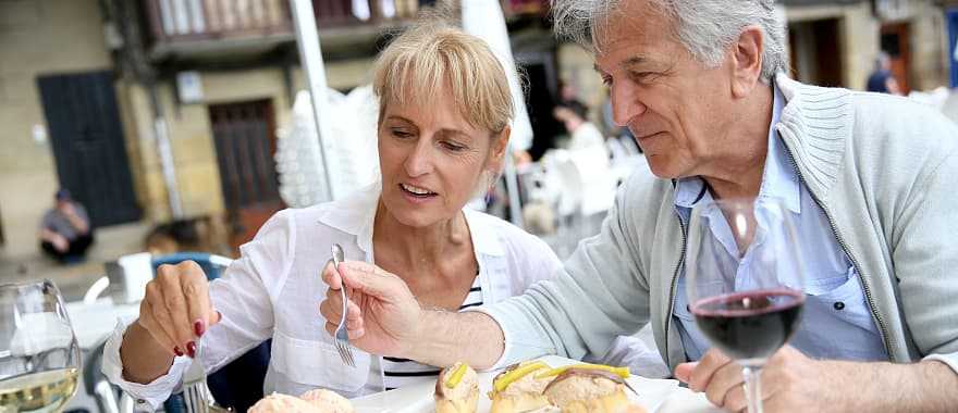 Couple enjoys some food and wine in Spain