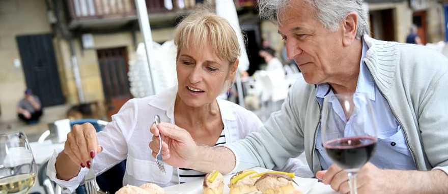 Couple enjoys some food and wine in Spain