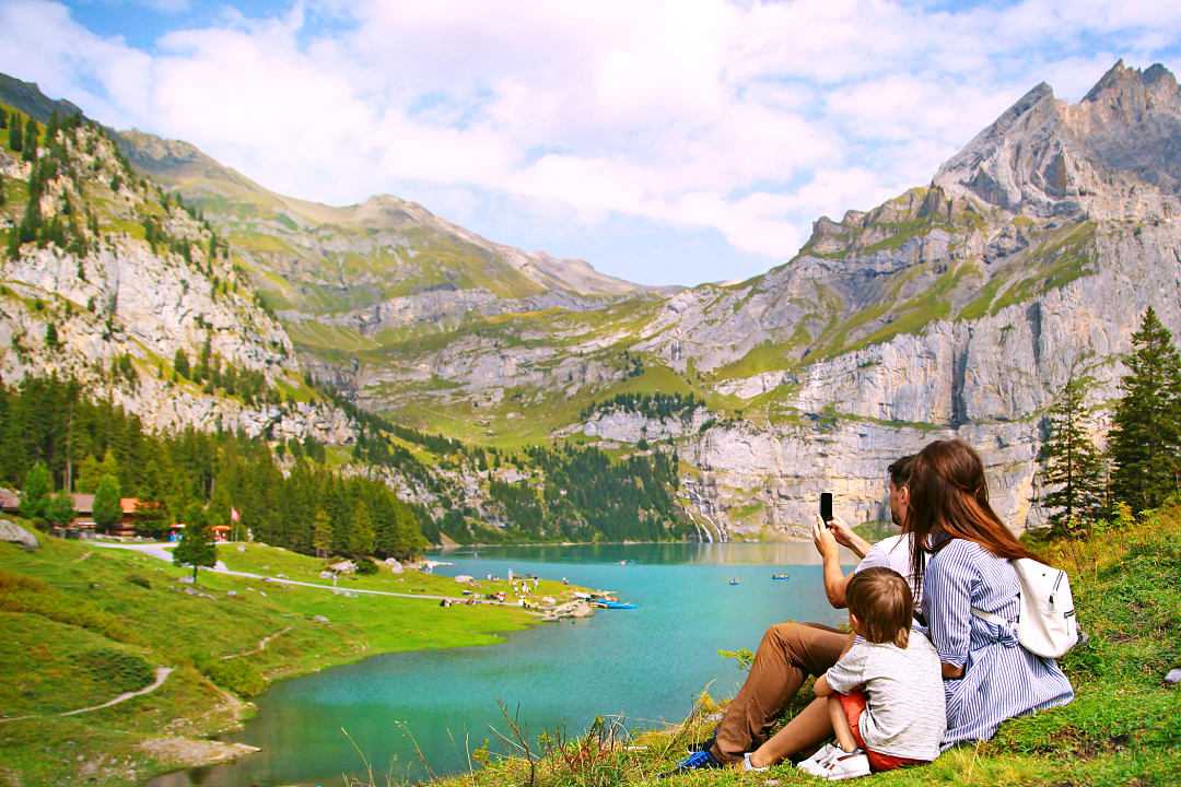 Family photographing nature in Switzerland