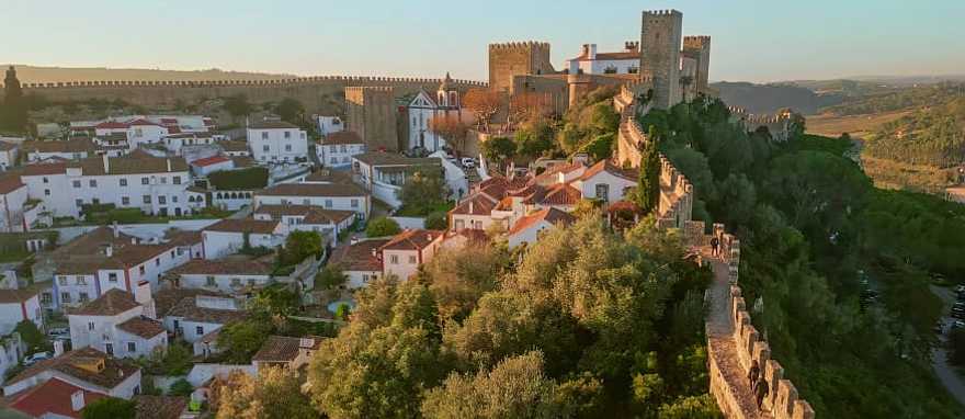 Panoramic view of the medieval town of Óbidos, Portugal, with historic walls and charming white houses