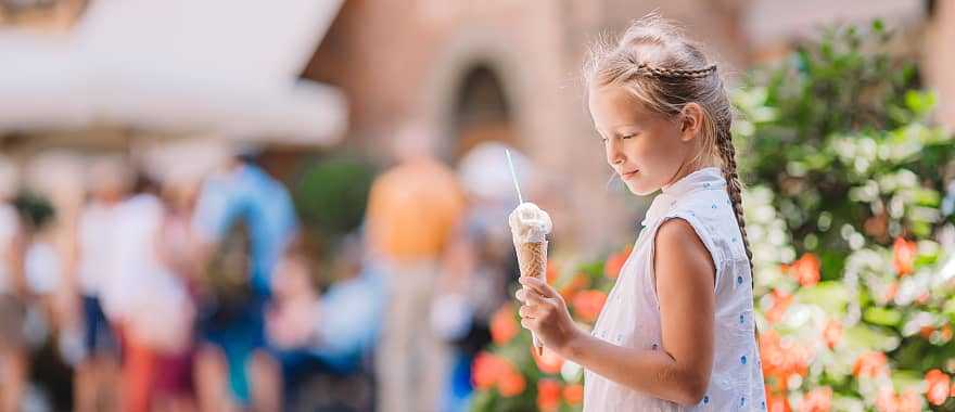 Young girl enjoying a gelato in Rome, Italy
