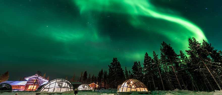 Aurora Borealis above igloos in Finland