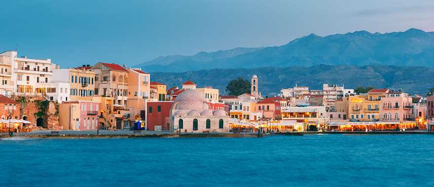 Venetian Quay of Chania with Kucuk Hasan Pasha Mosque during twilight blue hour, Crete, Greece