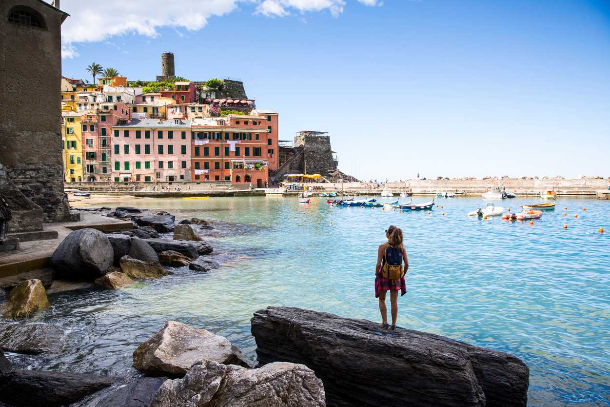 Woman looking out to sea in Vernazza, Cinque Terre.