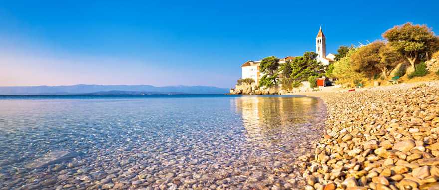 Pebble beach in Bol, Island of Brac, Dalmatia, Croatia Pebble beach in Bol, Island of Brac, Dalmatia, Croatia