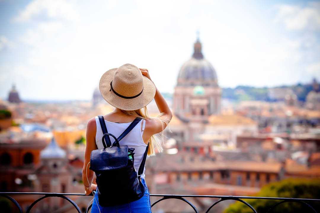 Woman enjoying the view of the Vatican in Rome, Italy