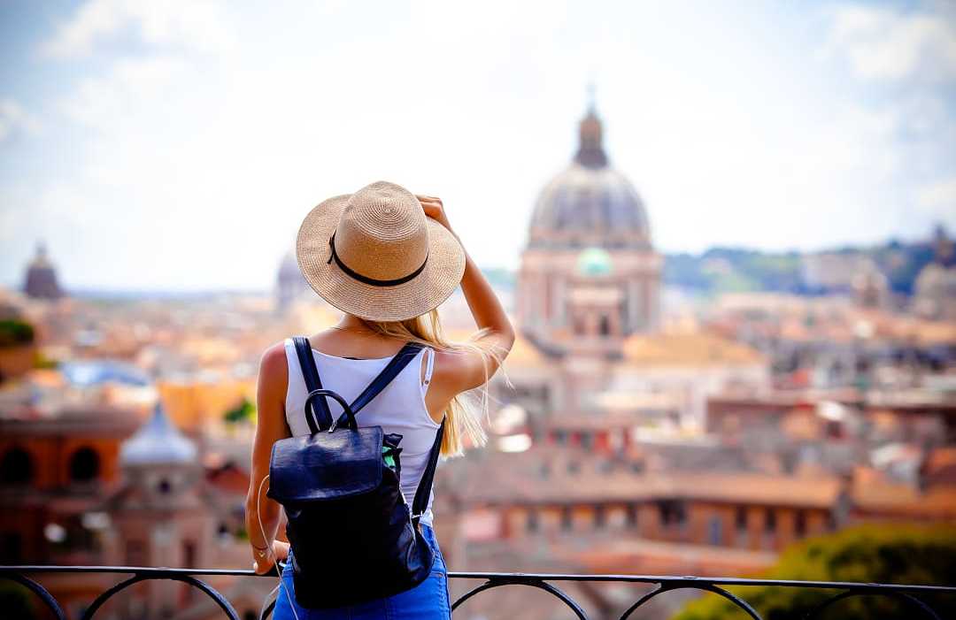 Woman enjoying the view of the Vatican in Rome, Italy
