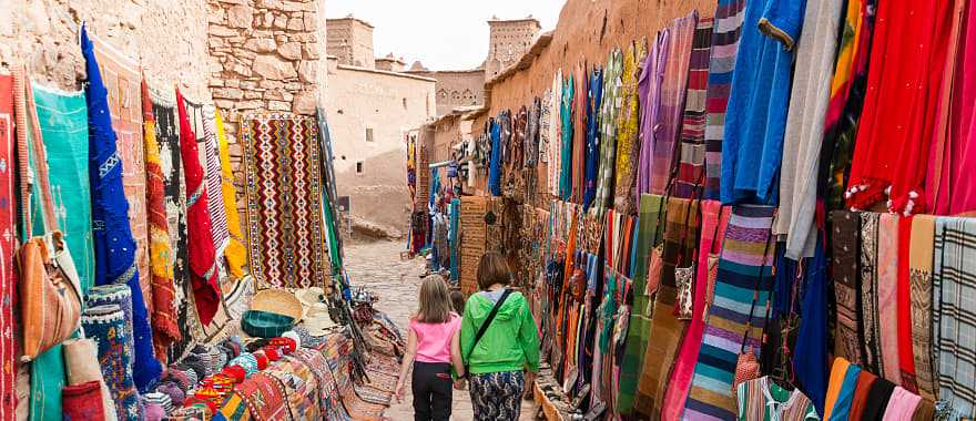 Mother and daughter walking on streets of Ait Benhaddou near Ouarzazate, Morocco