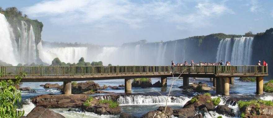 Visitors get a stunning view of Iguazu Falls from a viewing platform.