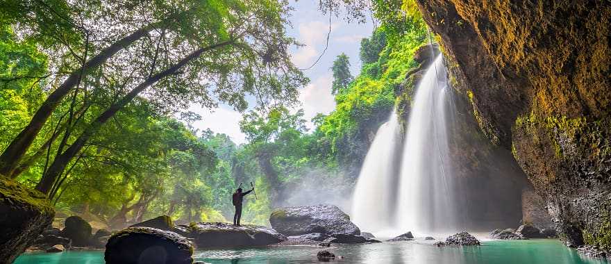 Hiker at Haew Suwat waterfall in Khao Yai National Park, Thailand