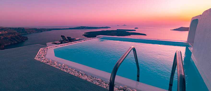 Athens & Santorini Honeymoon Package - Infinity pool overlooking the Aegean Sea at sunset in Santorini, Greece