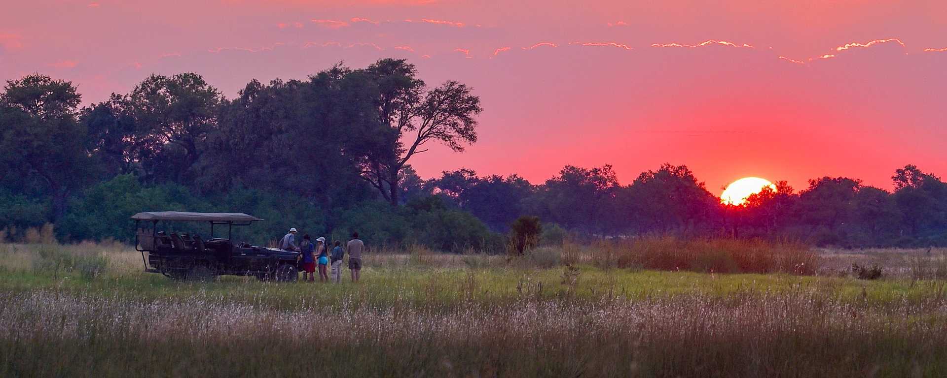 Family on safari in the Okavango Delta, Botswana