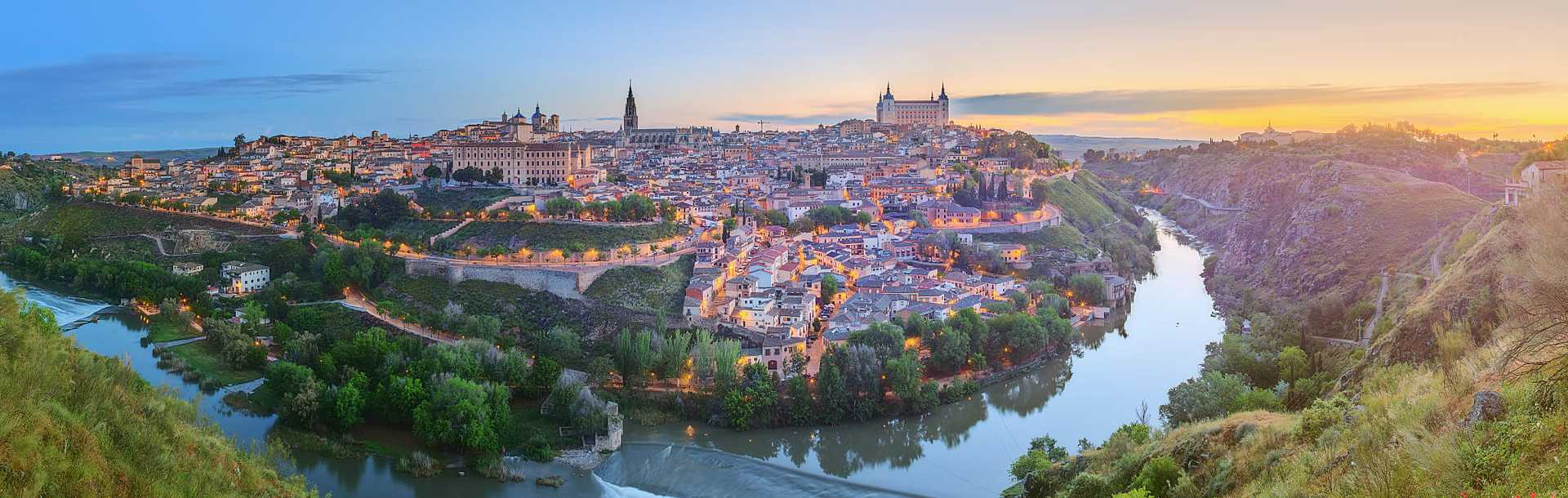 Panoramic view of ancient city and alcazar on a hill over the Tagus river, Castilla la Mancha, Toledo, Spain.
