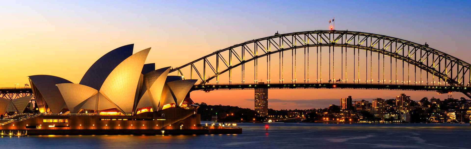 Sydney Opera House, Harbour Bridge, and Harbour in evening
