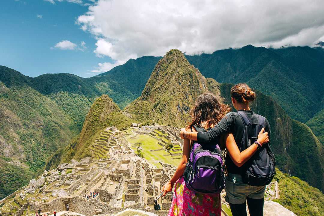 Couple at the gret Inca city of Machu Picchu in Peru