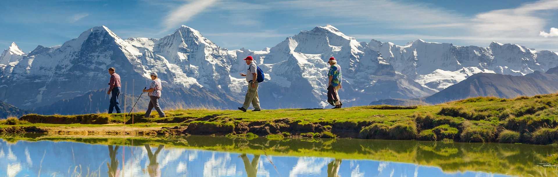 Senior travelers hiking in Bernese Oberland, Switzerland