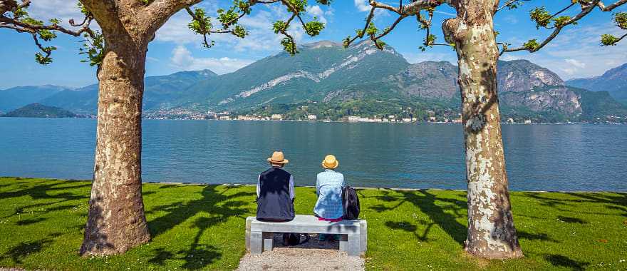 Senior couple enjoying the blue surface of Lake Como, Italy