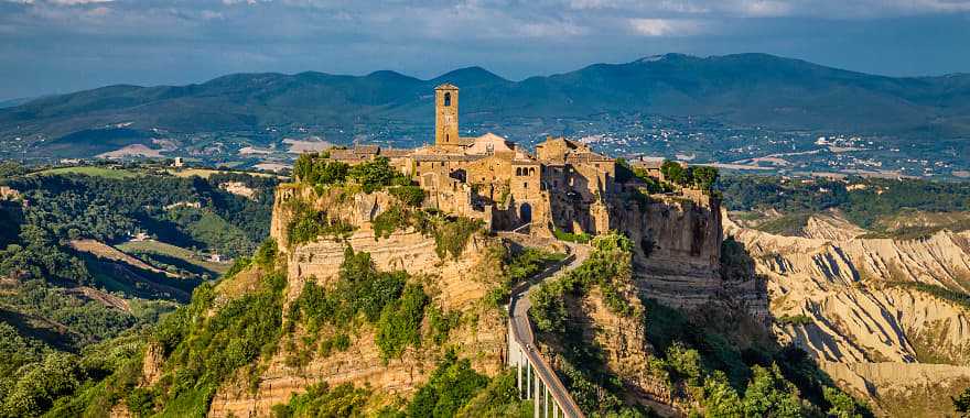 Beautiful view of the famous Civita di Bagnoregio in golden evening light at sunset, Lazio, Italy