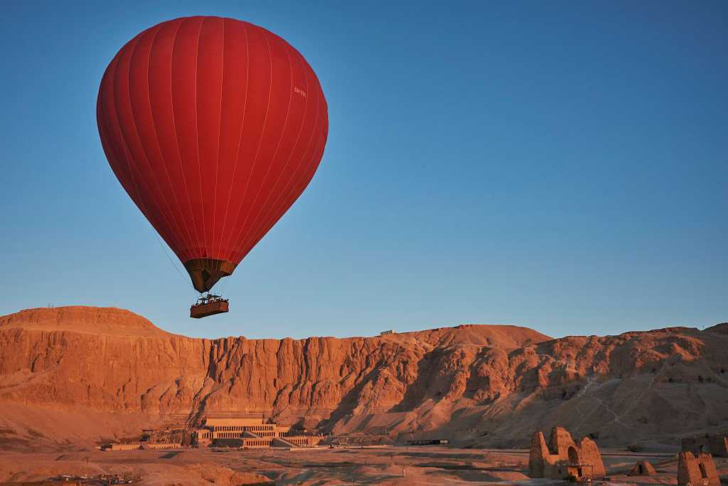 Hot air balloon over Asasif Valley and the Temple of Hatshepsut in Luxor, Egypt