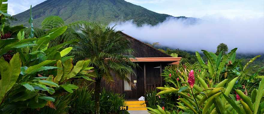 Small cabin with Volcano Arenal in the background in Costa Rica