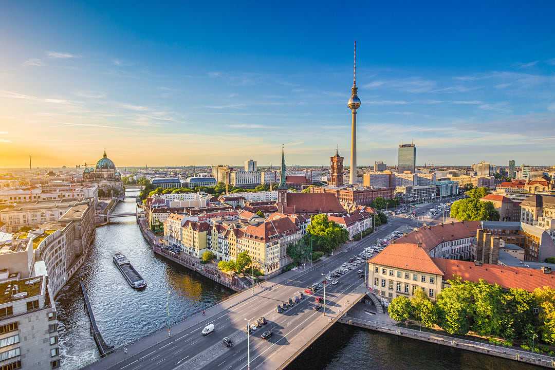 Berlin skyline with famous TV tower and Spree river 