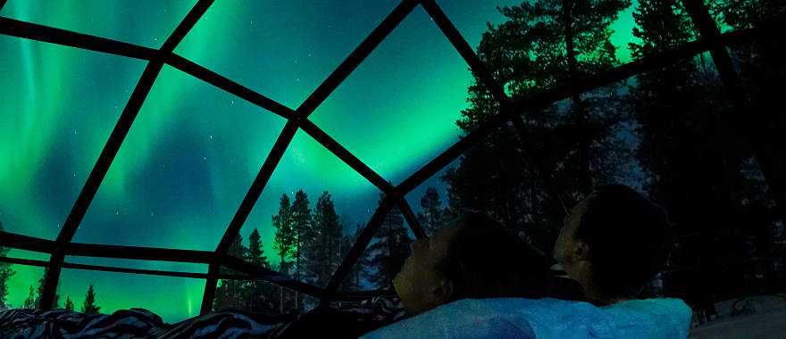 View of the Northern Lights from a glass igloo