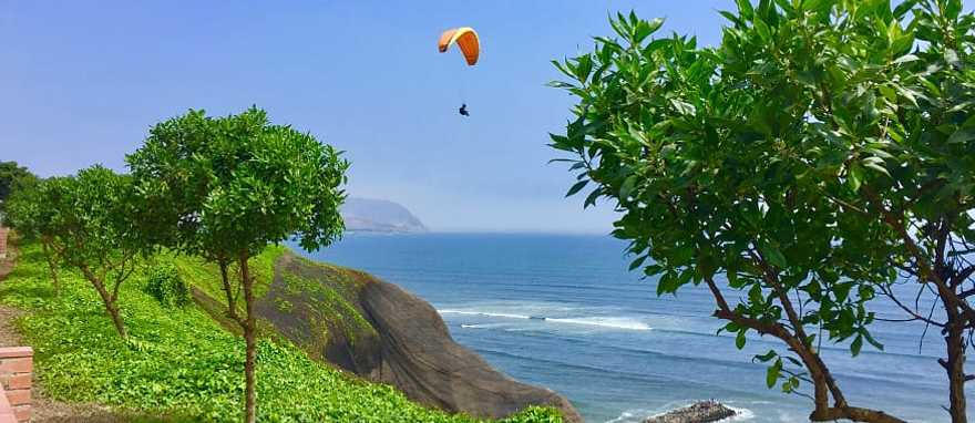 People paragliding in Miraflores, Lima, Peru.