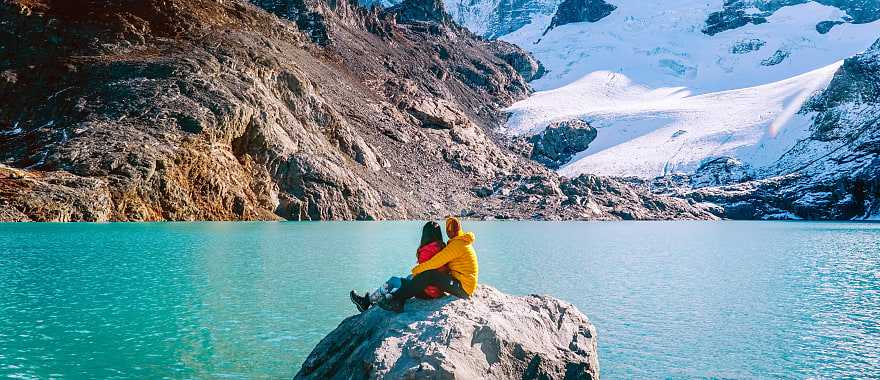 Couple admiring mount Fitzroy in the Argentinian Patagonia