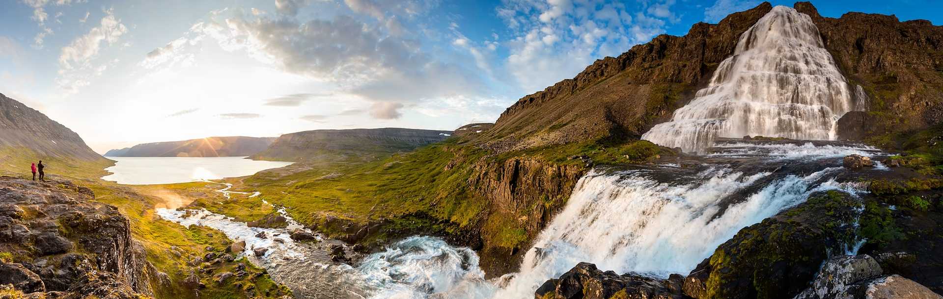 Couple at Dynjandi Waterfalls in the the Westfjords, Iceland