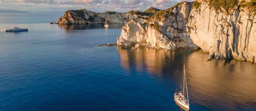 Ponza, Italy Sailboats at sunset around the beautiful island of Ponza in Italy