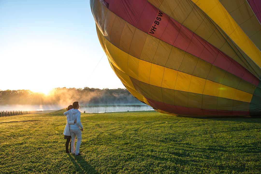 Couple waiting for hot air balloon ride in Hunter Valley, Australia