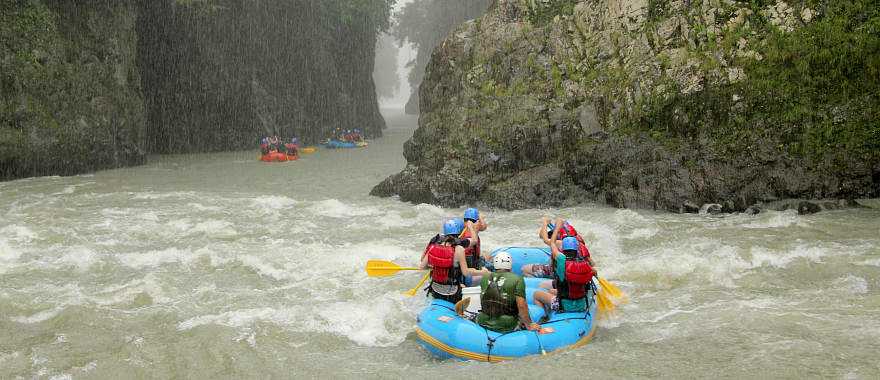 Rafting down the mountain river along the stunning waterfalls