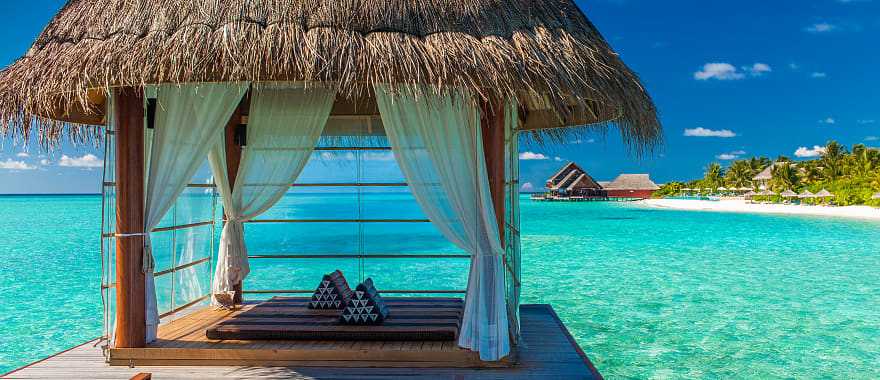 Bungalows over turquoise water in Bora Bora