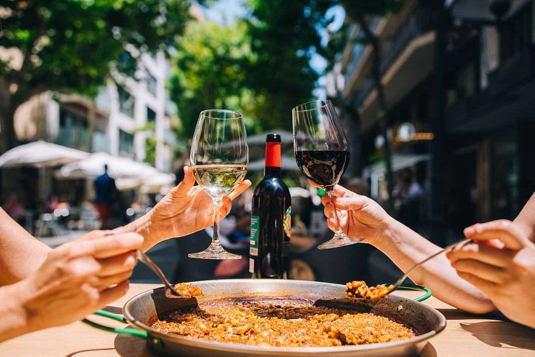Spanish paella and wine served at a restaurant