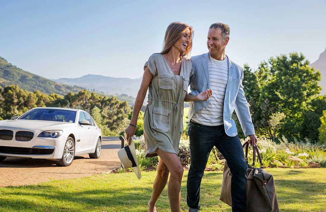 Couple arriving at their vacation destination Couple arriving at their vacation destination