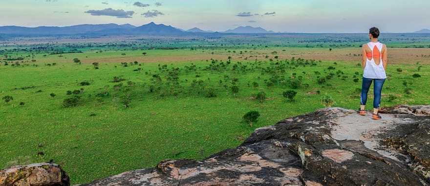 Woman admiring the landscape of Kidepo Valley National Park, Uganda