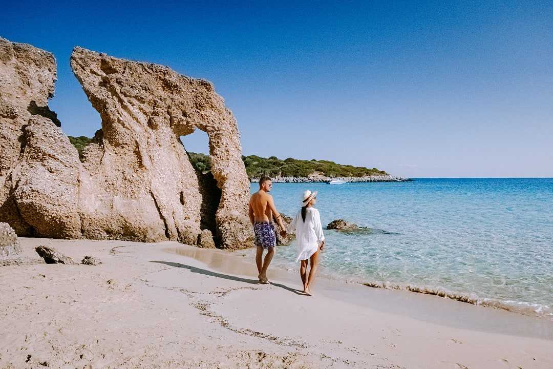 Couple at Voulisma beach on Crete island, Greece