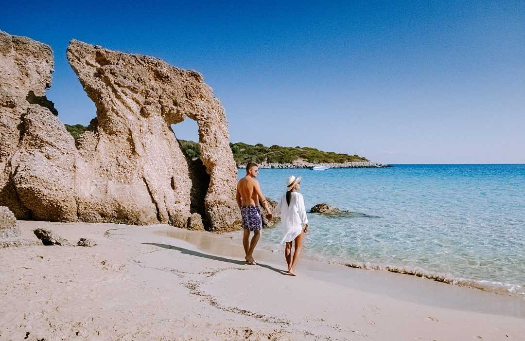 Crete, Greece Couple at Voulisma beach on Crete island, Greece