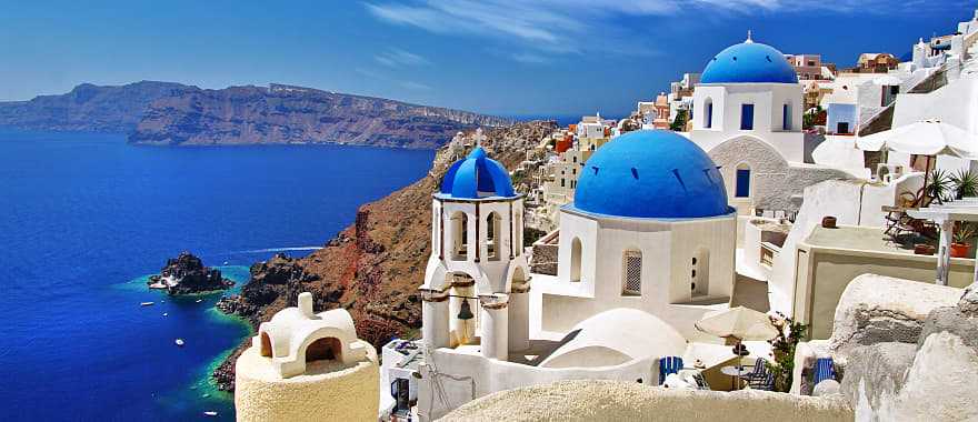 Santorini blue domes with caldera and ocean