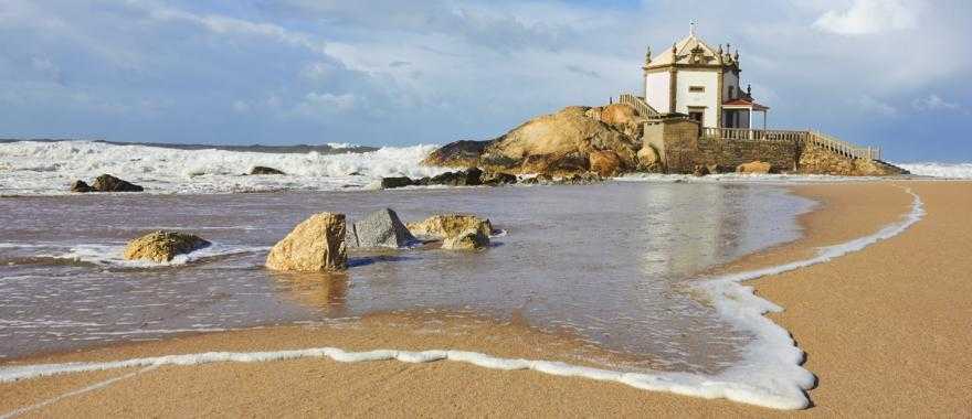 Capela do Senhor da Pedra, a small church on the shore, Porto, Portugal